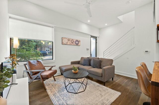 living room featuring plenty of natural light, baseboards, dark wood finished floors, recessed lighting, and ceiling fan
