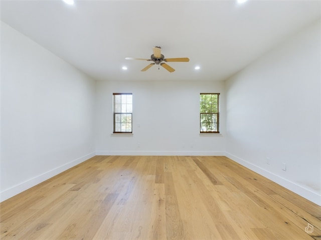 unfurnished room featuring ceiling fan and light wood-type flooring