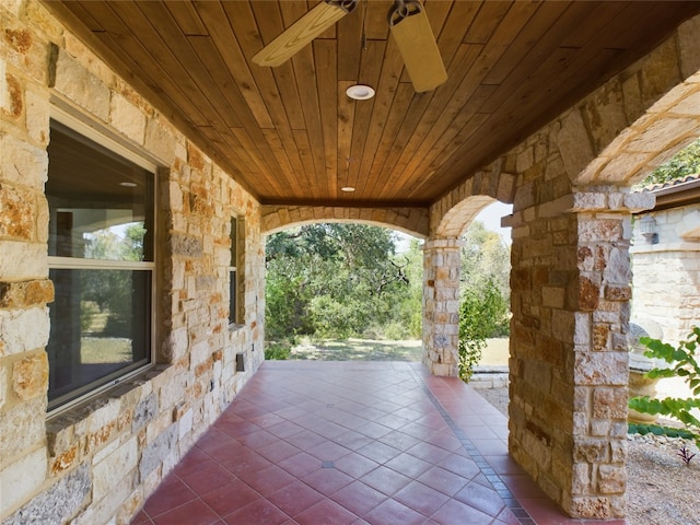 view of patio featuring ceiling fan