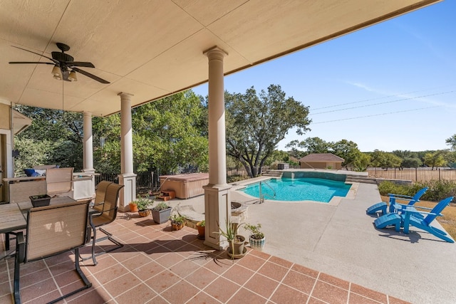 view of pool featuring a patio, a hot tub, and ceiling fan