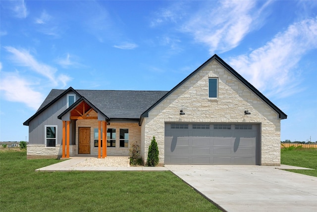 view of front of property featuring a garage and a front lawn