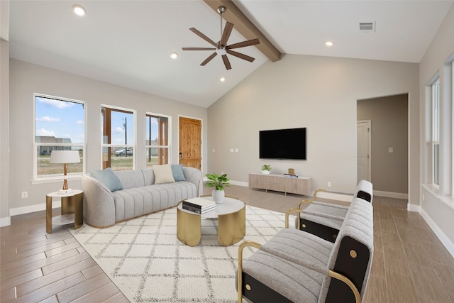 living room with beamed ceiling, high vaulted ceiling, light wood-type flooring, and ceiling fan