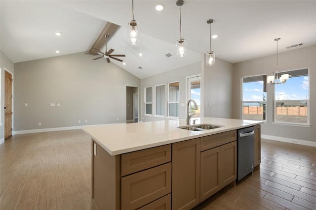 kitchen featuring vaulted ceiling with beams, sink, light wood-type flooring, and hanging light fixtures