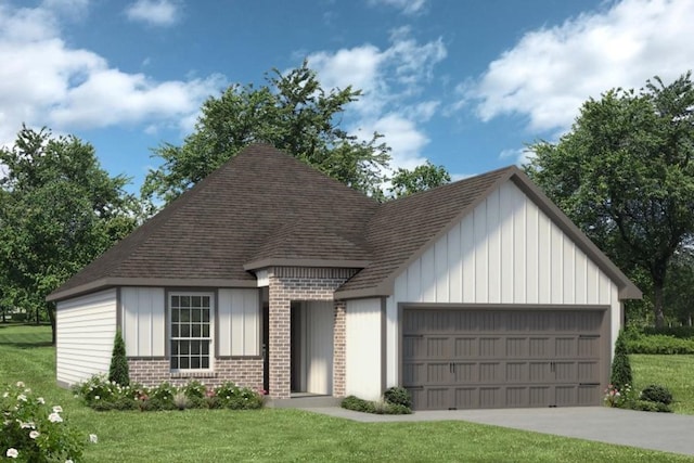 view of front of home featuring a garage and a front lawn