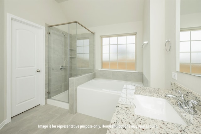 bathroom featuring vanity and shower with separate bathtub