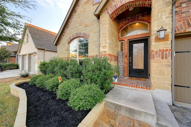 entrance to property featuring a garage