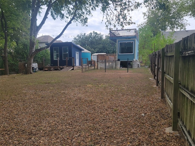 view of yard with a wooden deck