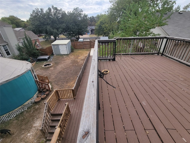 wooden terrace with a storage unit