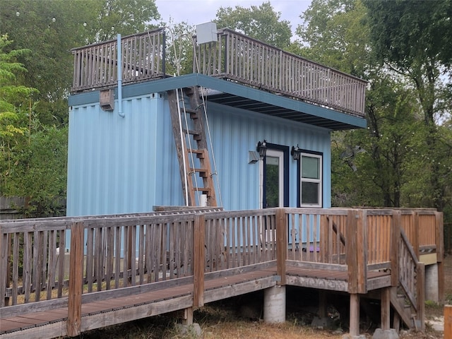 view of home's exterior with a wooden deck