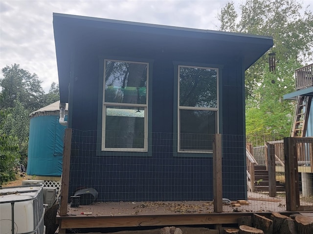 view of side of home featuring a deck