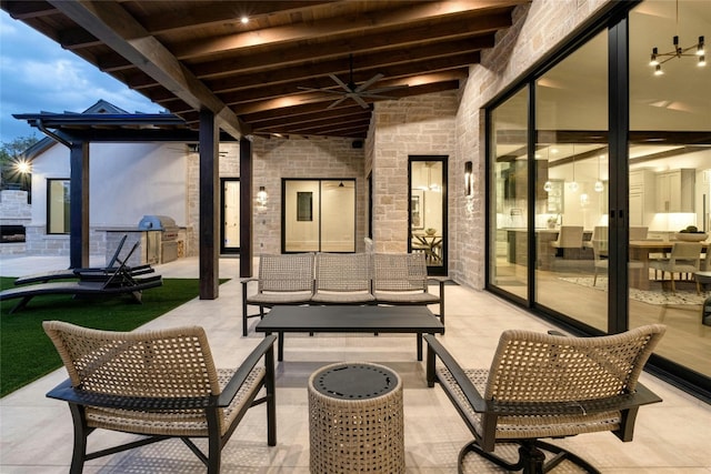 view of patio / terrace with ceiling fan and an outdoor living space