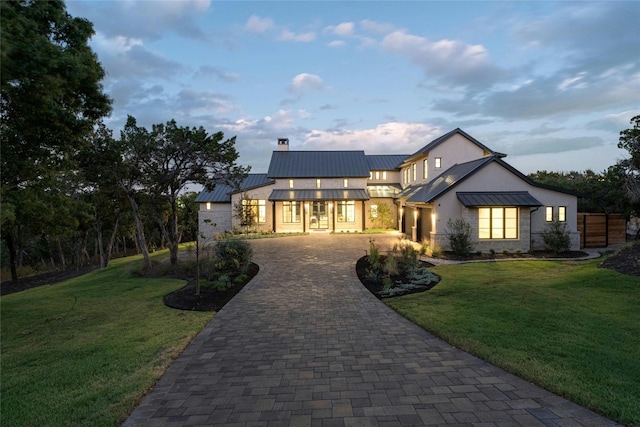 view of front of home with a yard