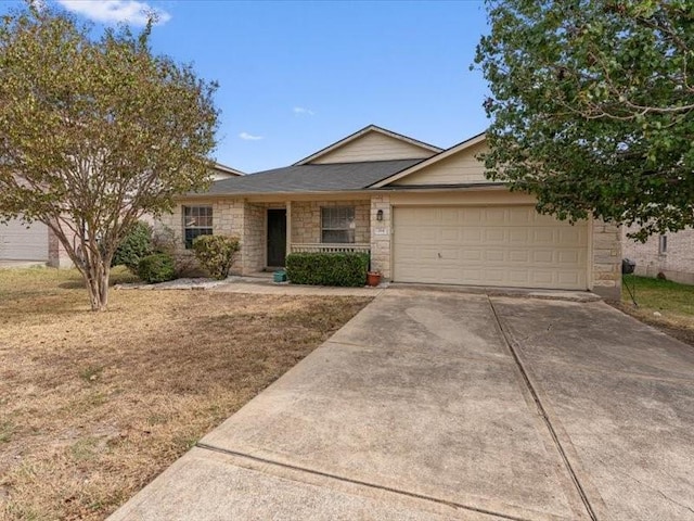 ranch-style home with covered porch and a garage