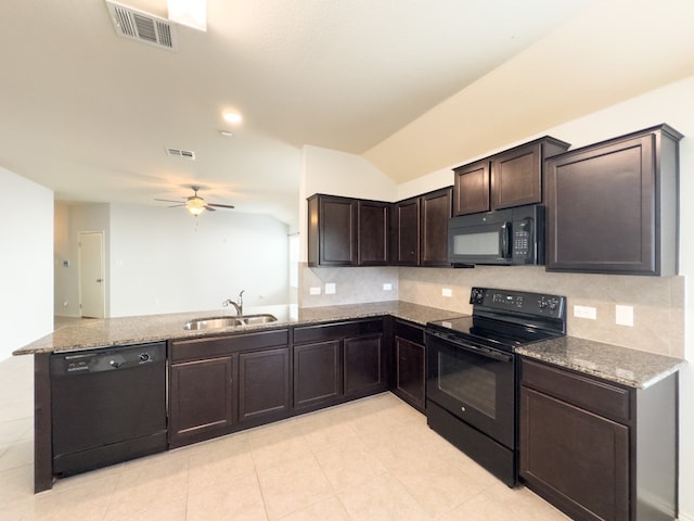 kitchen with sink, tasteful backsplash, black appliances, and vaulted ceiling