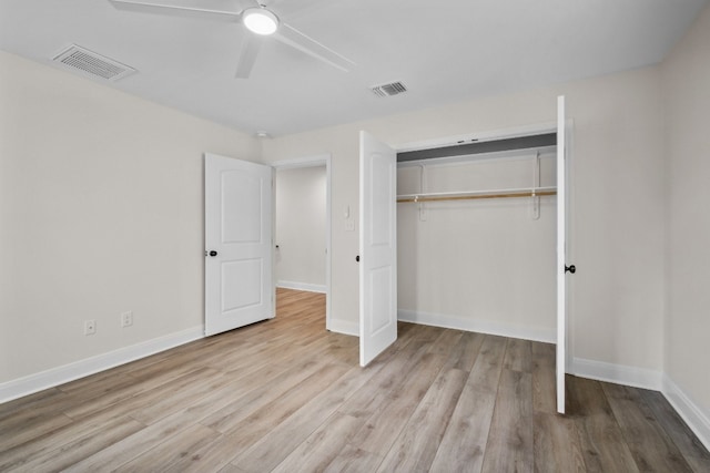 unfurnished bedroom with a closet, light wood-type flooring, and ceiling fan