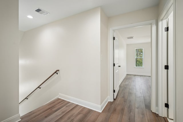 corridor with light hardwood / wood-style flooring