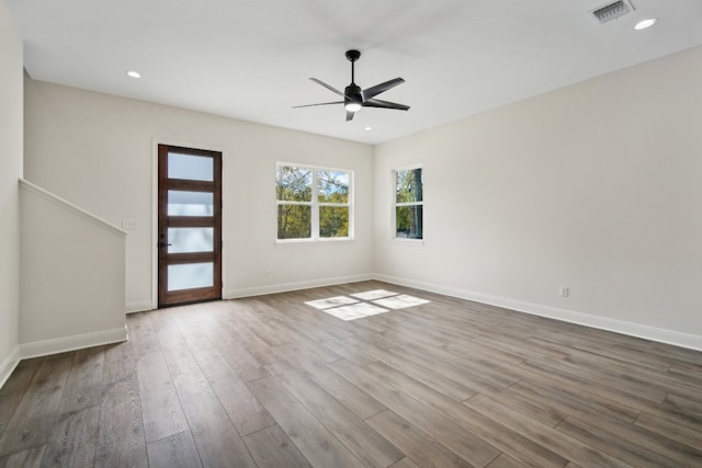 spare room with light hardwood / wood-style floors and ceiling fan