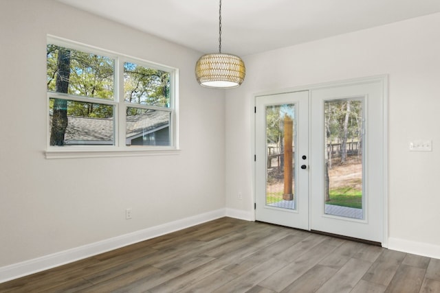 doorway to outside with french doors and wood-type flooring