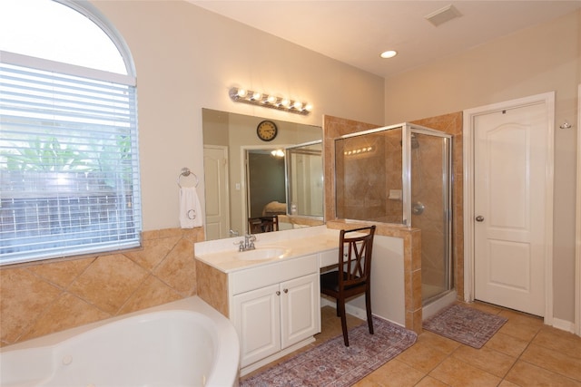 bathroom with vanity, plus walk in shower, and tile patterned floors