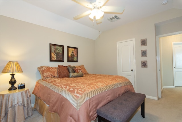 bedroom featuring light carpet, ceiling fan, and vaulted ceiling