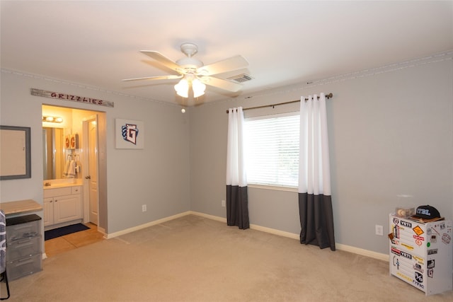 interior space featuring light carpet and ceiling fan