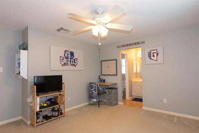 office with ceiling fan and light colored carpet