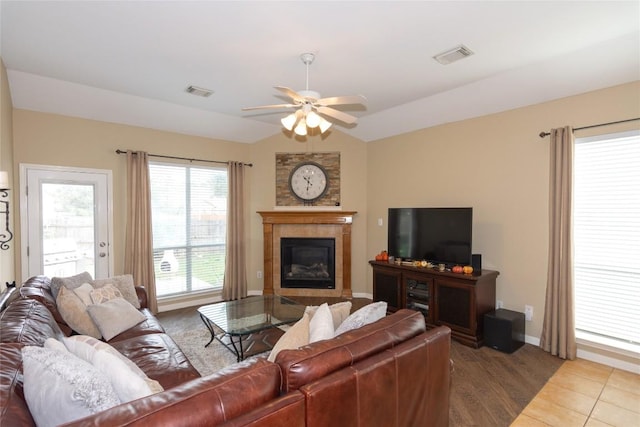 506 Fern Ct, Cedar Park, TX 78613 - living room featuring ceiling fan, lofted ceiling, and a tiled fireplace