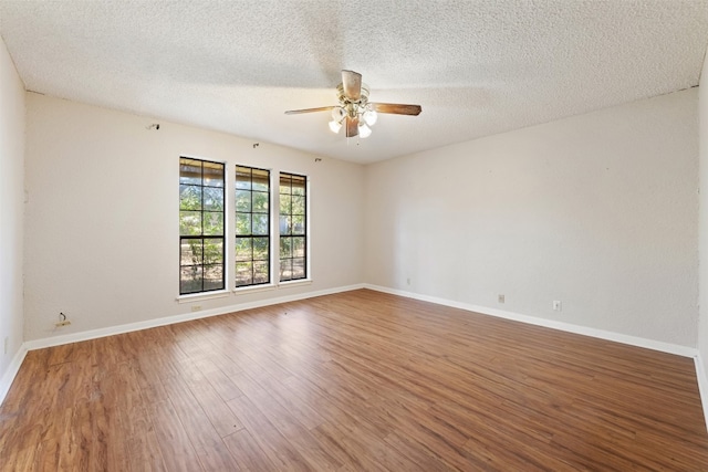 unfurnished room with a textured ceiling, hardwood / wood-style flooring, and ceiling fan