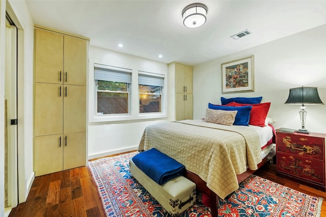 bedroom featuring dark hardwood / wood-style flooring