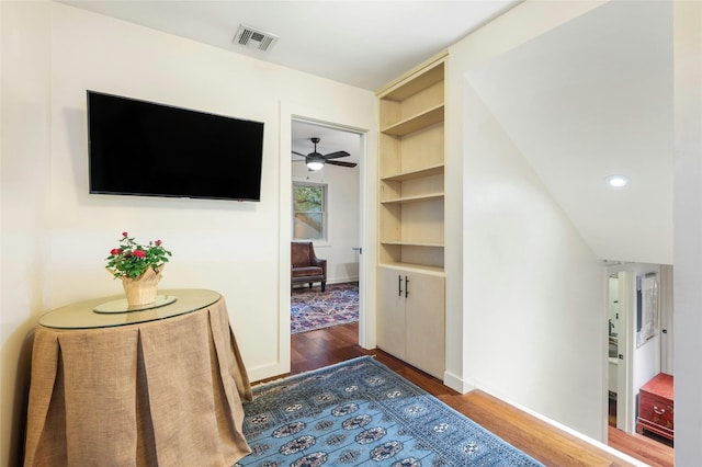 hallway featuring dark hardwood / wood-style flooring