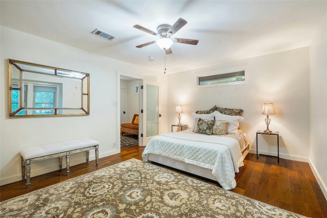 bedroom featuring ceiling fan and dark hardwood / wood-style floors