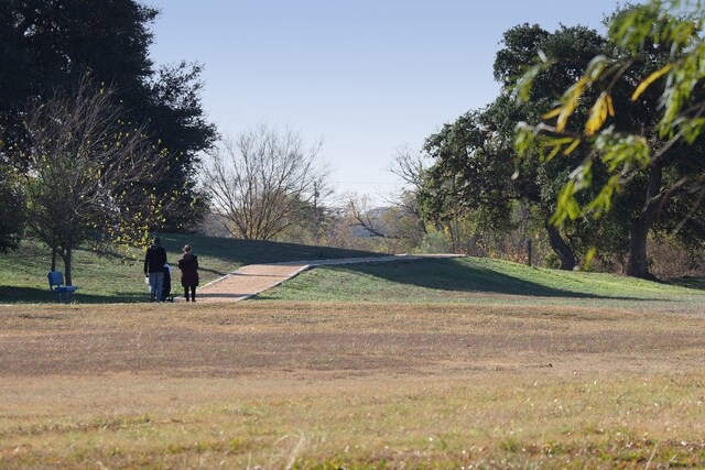 surrounding community featuring a lawn