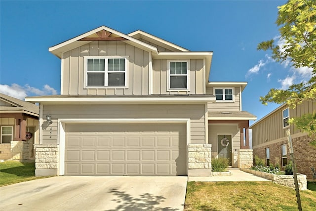 view of front of house with a front yard and a garage