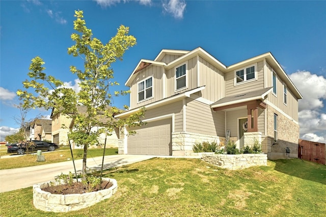 view of front of home featuring a front lawn and a garage