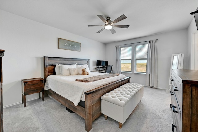 bedroom featuring ceiling fan and light carpet