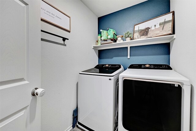 clothes washing area featuring washing machine and dryer