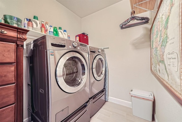 laundry area with separate washer and dryer