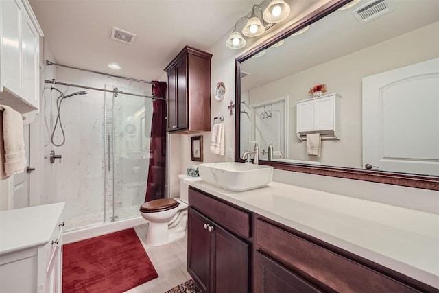 bathroom with walk in shower, vanity, and toilet