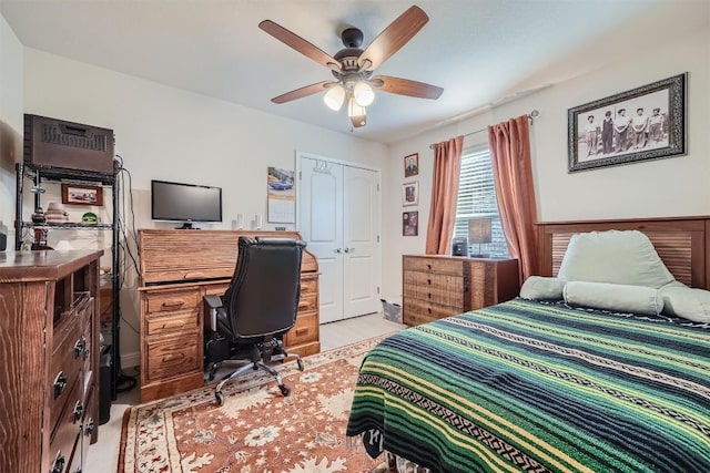 bedroom featuring ceiling fan and a closet