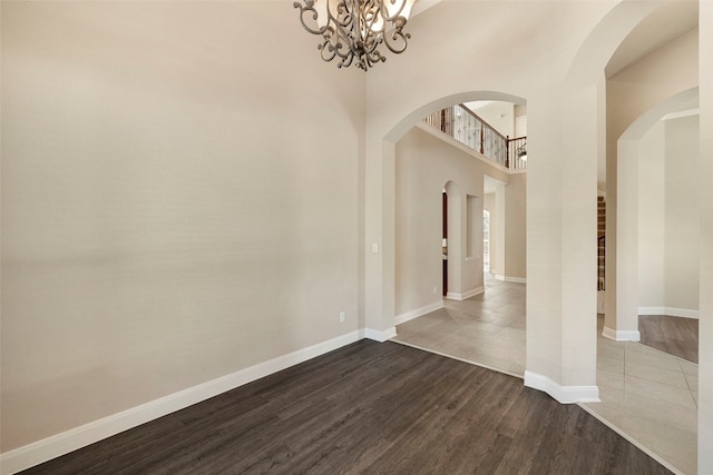 foyer featuring an inviting chandelier and hardwood / wood-style floors