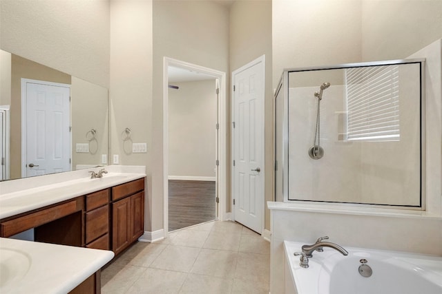 bathroom with vanity, shower with separate bathtub, and tile patterned flooring