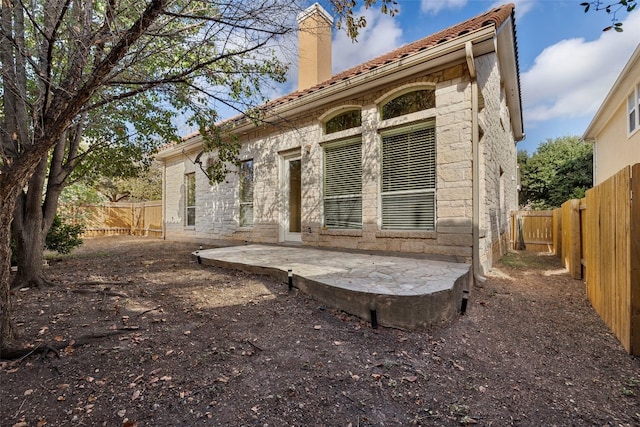 rear view of property with a patio area