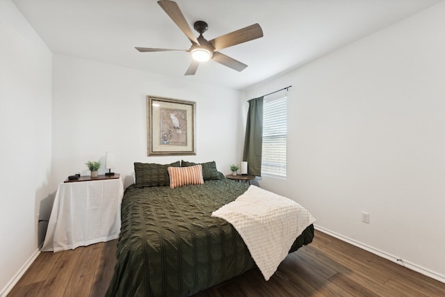 bedroom featuring dark hardwood / wood-style floors and ceiling fan