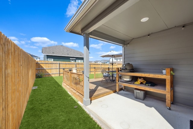 exterior space with a deck and a grill