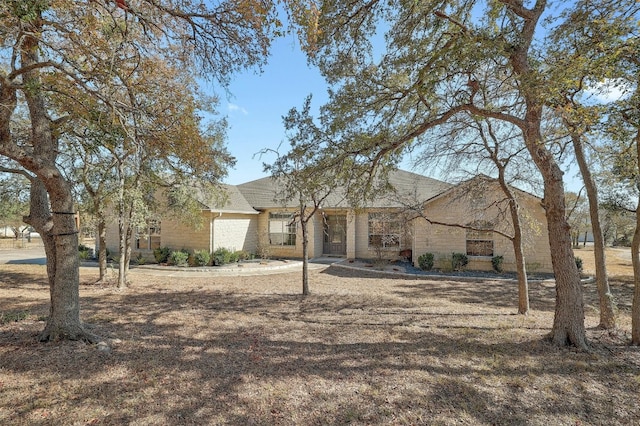 ranch-style house featuring a garage