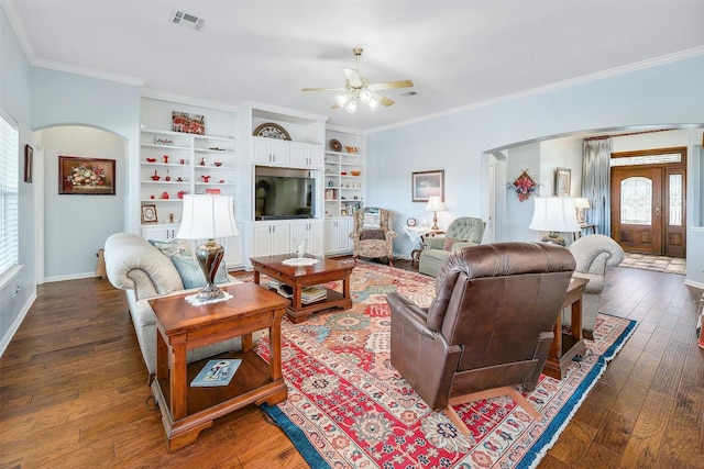 living room featuring ornamental molding, dark hardwood / wood-style floors, built in features, and ceiling fan