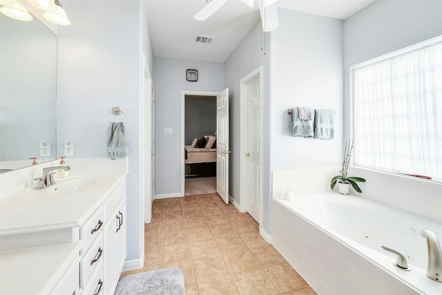 bathroom with vanity, a bathtub, and tile patterned floors