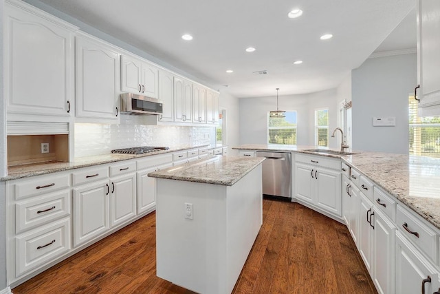 1900 County Road 245, Georgetown, TX 78633 - kitchen with stainless steel appliances, recessed lighting, backsplash, a center island, and white cabinets