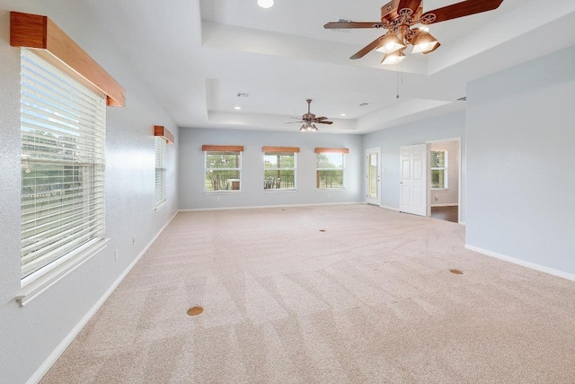 1900 County Road 245, Georgetown, TX 78633 - carpeted spare room with a tray ceiling, a ceiling fan, and recessed lighting