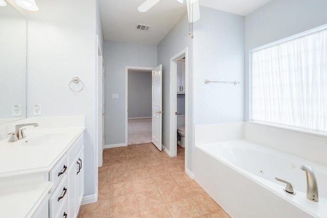 1900 County Road 245, Georgetown, TX 78633 - full bathroom with vanity, a whirlpool tub, and a ceiling fan